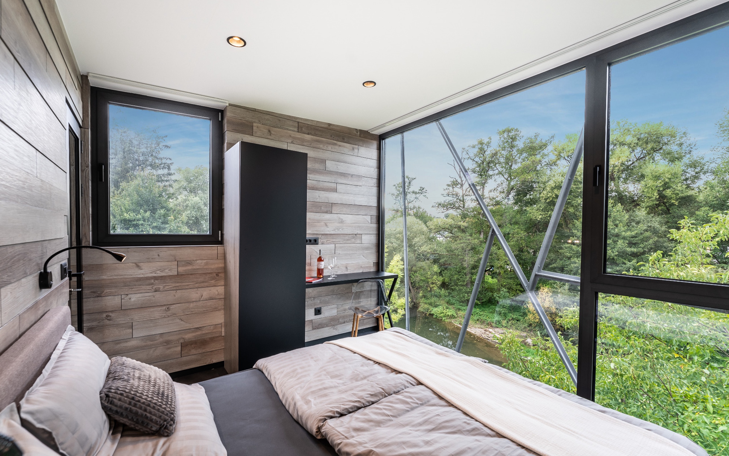 DQTower bedroom with a large panoramic window
